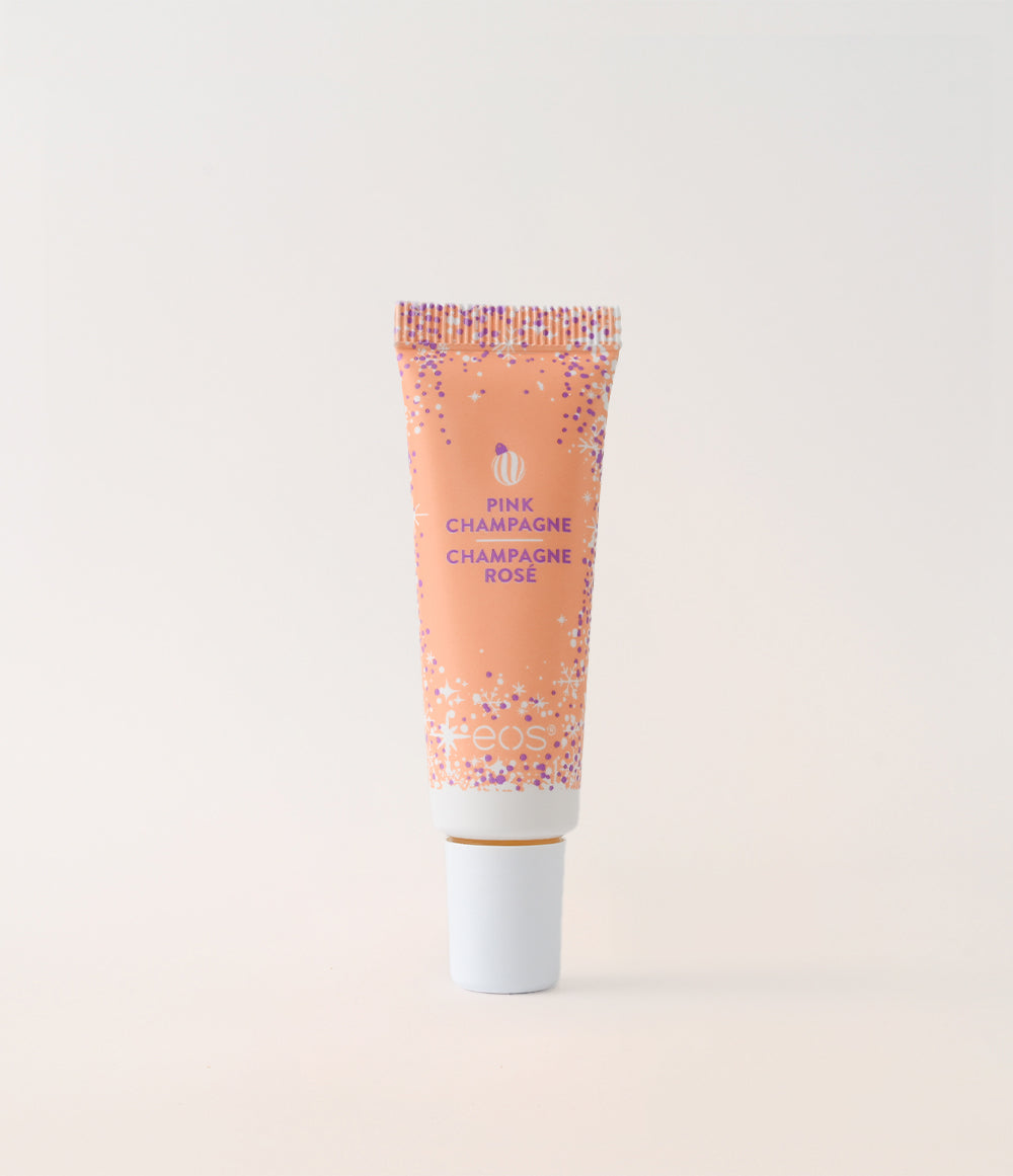 Tub of 'Pink Champagne' lip balm on a light beige background